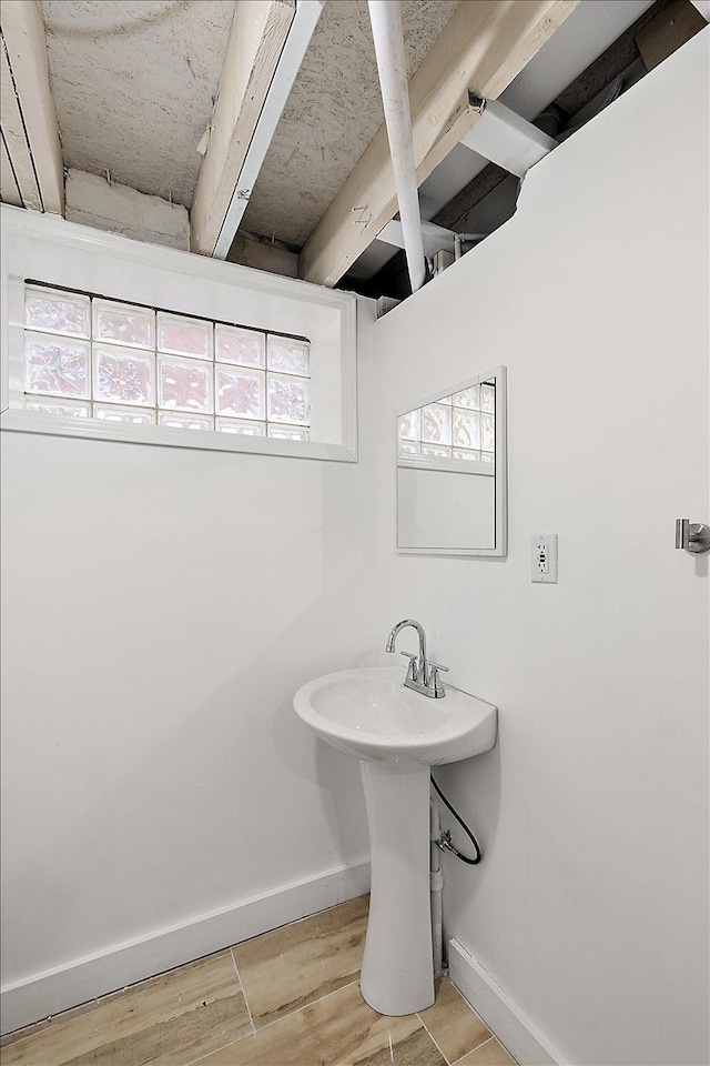 bathroom featuring sink and wood-type flooring