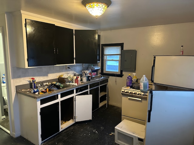 kitchen featuring sink, tile countertops, electric panel, and white refrigerator