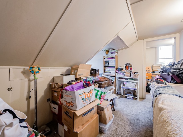 interior space with lofted ceiling and carpet