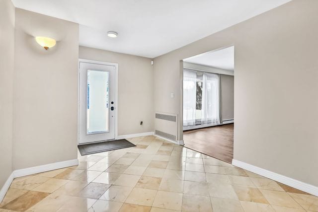 tiled entryway with radiator heating unit