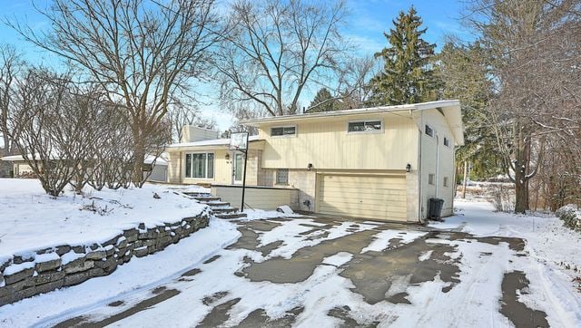 split level home with a garage