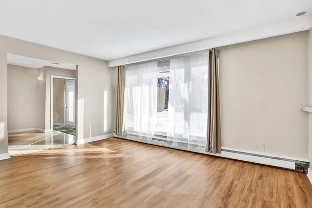 unfurnished room featuring light hardwood / wood-style flooring