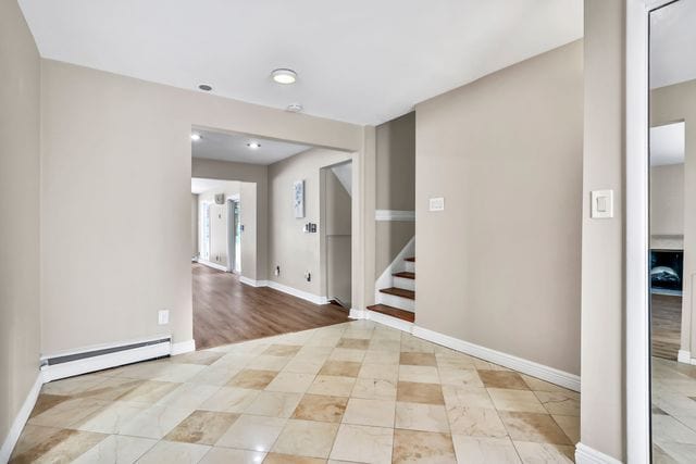 interior space featuring baseboard heating