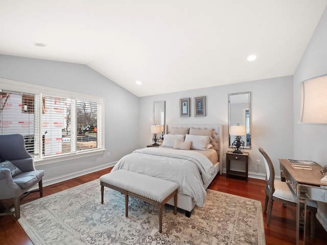 bedroom with lofted ceiling and dark hardwood / wood-style floors