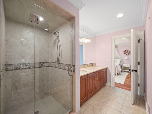 bathroom featuring tile patterned flooring, ornamental molding, vanity, and walk in shower