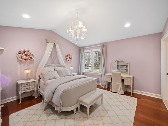 bedroom featuring hardwood / wood-style flooring, vaulted ceiling, and a chandelier