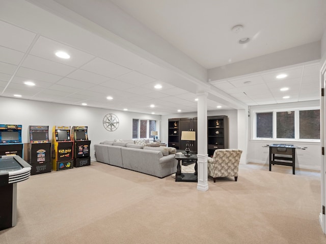 living room featuring light carpet and a drop ceiling