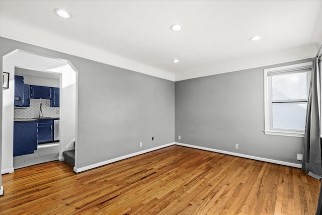 spare room with light hardwood / wood-style floors