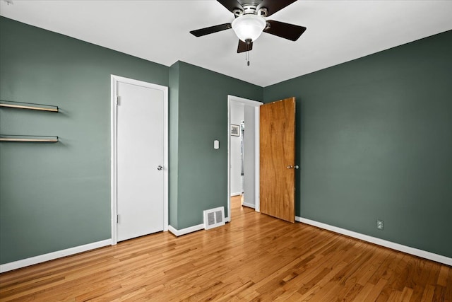 unfurnished bedroom featuring light hardwood / wood-style floors and ceiling fan