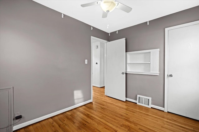 unfurnished bedroom featuring ceiling fan and light hardwood / wood-style flooring