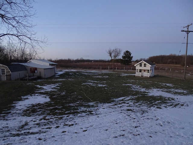 view of yard covered in snow