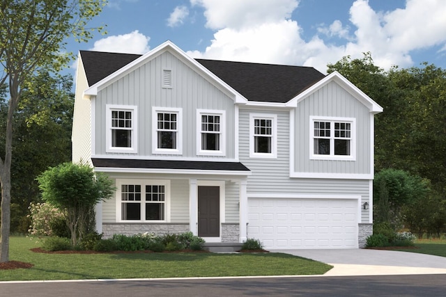 view of front of property featuring a garage and a front yard