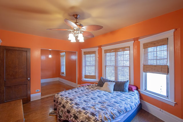 bedroom featuring ceiling fan and dark hardwood / wood-style flooring