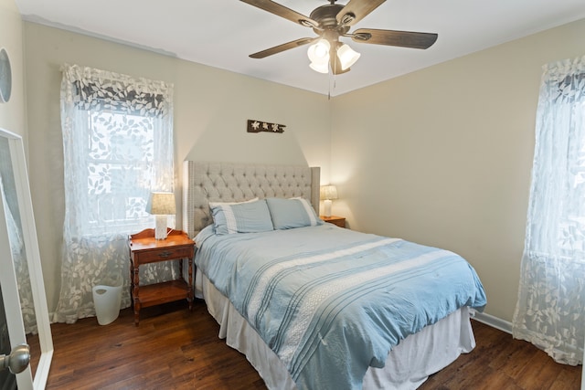 bedroom featuring ceiling fan and dark hardwood / wood-style flooring