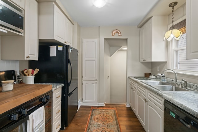 kitchen with white cabinets and black appliances