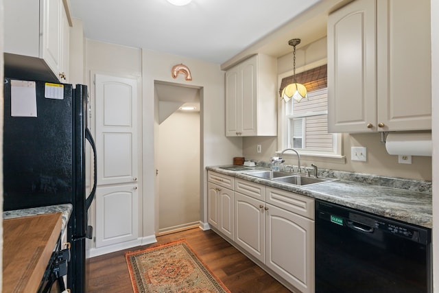 kitchen with white cabinetry, sink, pendant lighting, and black appliances