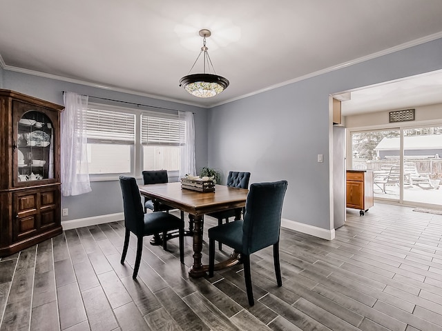 dining area with crown molding and dark hardwood / wood-style flooring