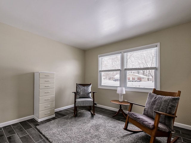 sitting room with dark hardwood / wood-style flooring