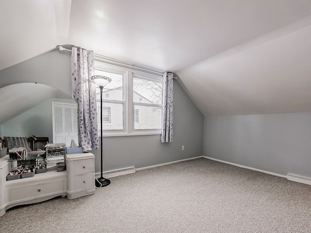 bonus room with baseboard heating, vaulted ceiling, and carpet