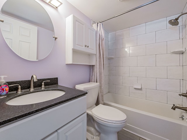 full bathroom with vanity, shower / bath combination with curtain, and toilet