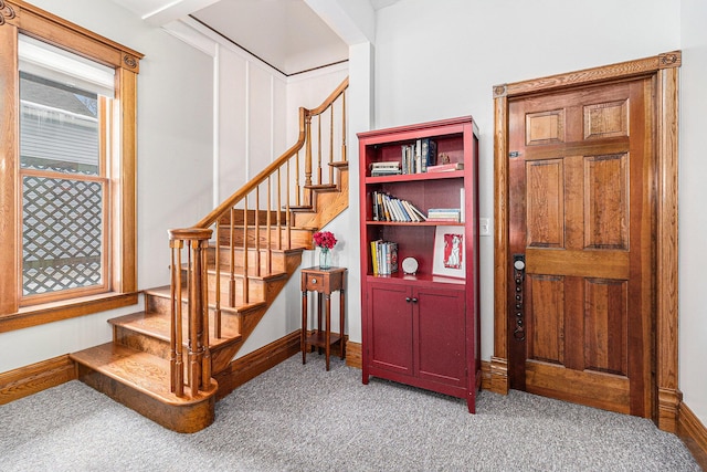 stairs featuring carpet