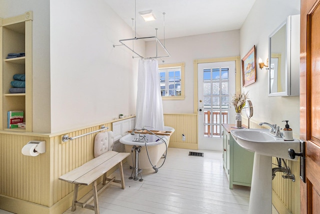 bathroom featuring a shower with curtain, wood-type flooring, and built in features