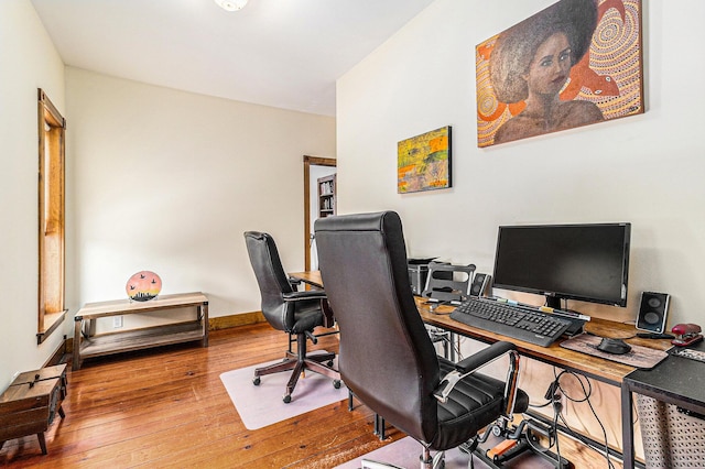 home office with hardwood / wood-style floors