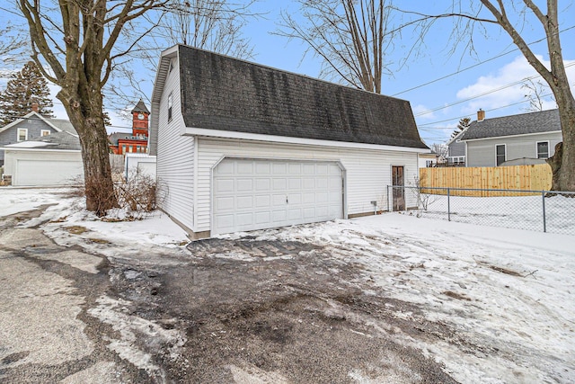 view of snow covered garage