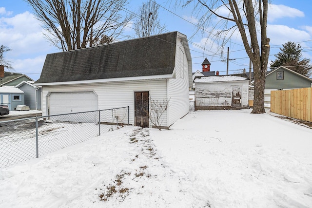 view of snow covered garage