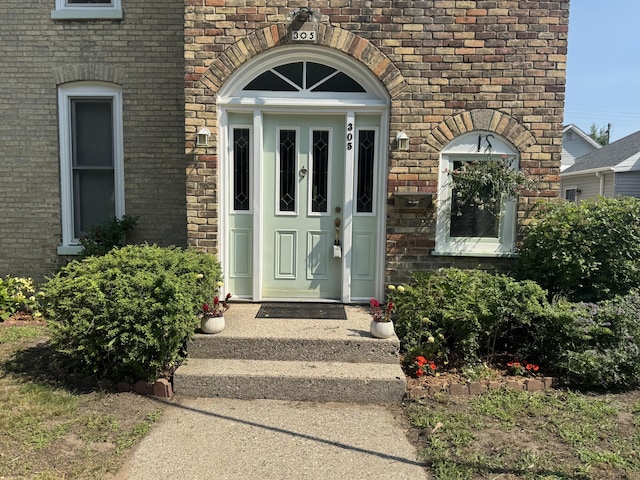 305 E Filer St, Ludington, MI 49431 - property entrance with brick siding