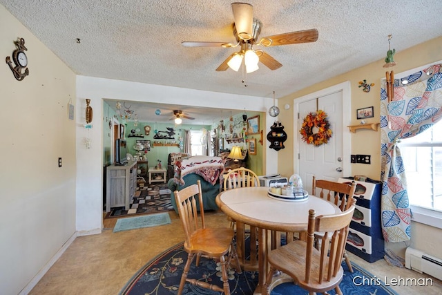 dining room with ceiling fan, a textured ceiling, and baseboard heating