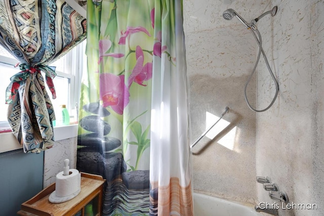 bathroom featuring shower / bath combo with shower curtain