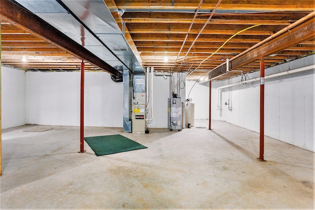 basement with water heater and heating unit