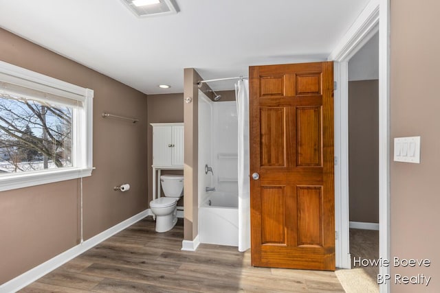 bathroom featuring shower / tub combo with curtain, wood-type flooring, and toilet