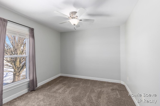 empty room featuring ceiling fan and carpet floors