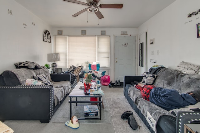 carpeted living room featuring ceiling fan