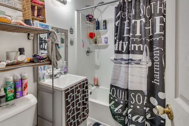 full bathroom featuring sink, toilet, and shower / bath combo with shower curtain