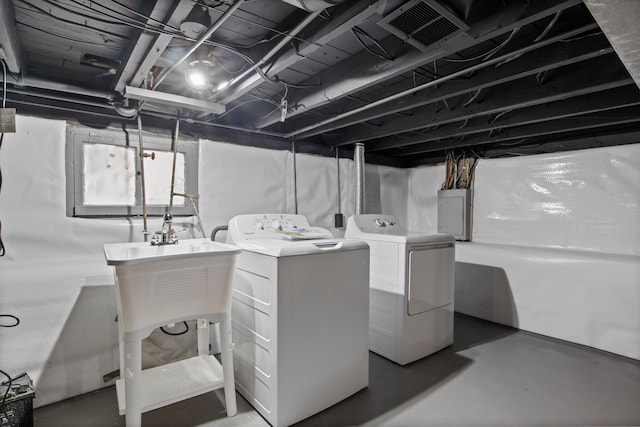 basement featuring washer and clothes dryer and electric panel