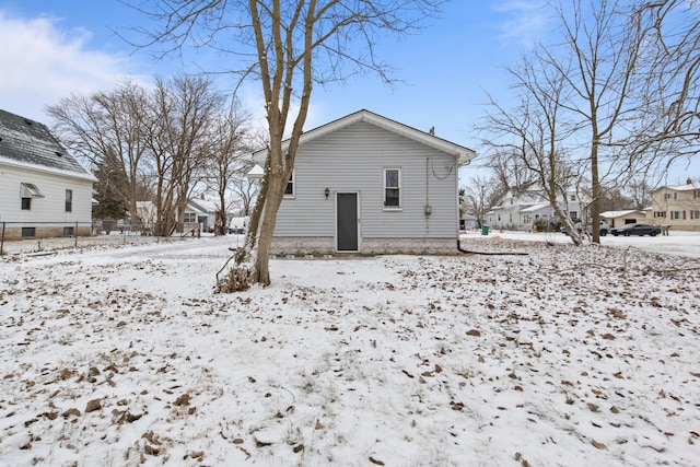 view of snow covered house