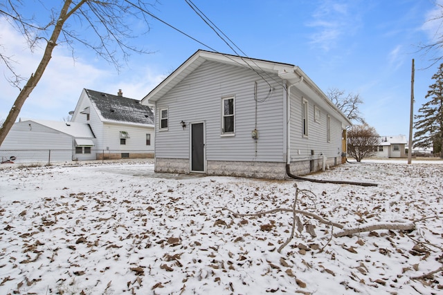 view of snow covered house