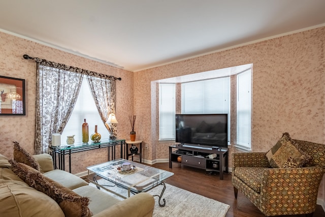 living room featuring ornamental molding, plenty of natural light, and dark hardwood / wood-style flooring