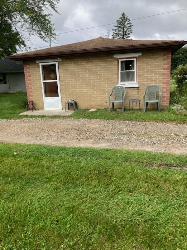 rear view of house with a lawn