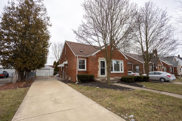 bungalow-style house with a front yard