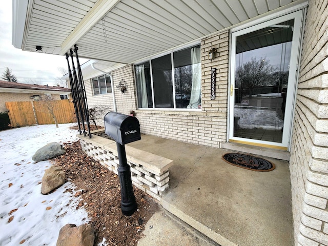 view of snow covered patio