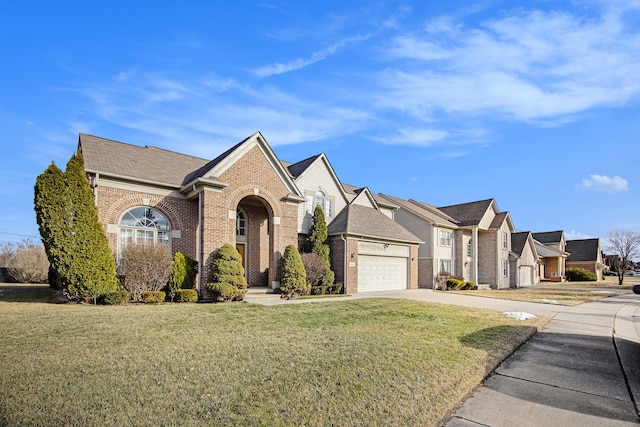 view of front of property with a garage and a front yard