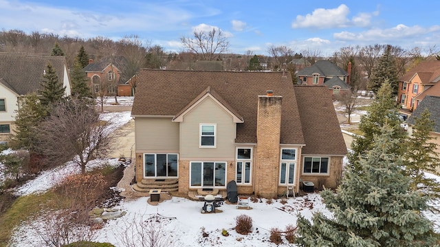 view of snow covered house