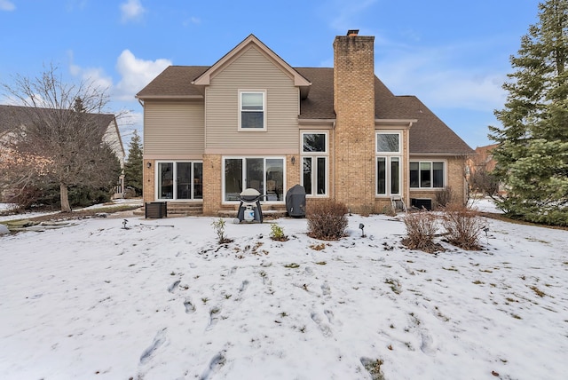 view of snow covered house