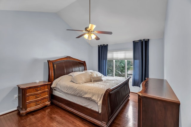 bedroom with vaulted ceiling, dark hardwood / wood-style floors, and ceiling fan