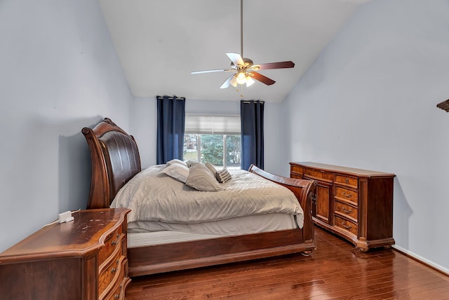 bedroom with ceiling fan, lofted ceiling, and dark hardwood / wood-style flooring