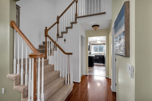 stairway featuring hardwood / wood-style flooring